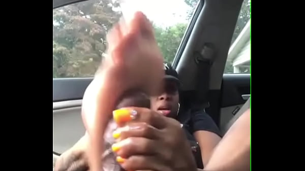 Hot ebony slut footjob to black cock in car
