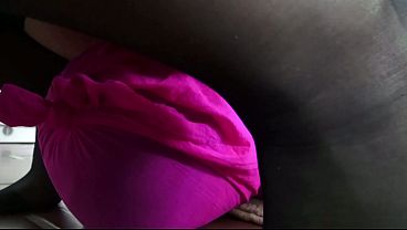 Goldie tramples her two slaves, who lie on the floor wrapped in pink and black nylo