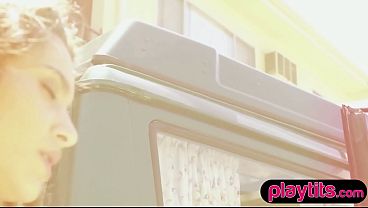 Petite brunette MILF strips nude in her car to flaunt perky boobs