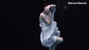 Redhead beauty in the white dress