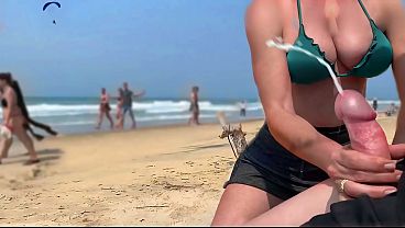 A stranger milf makes me cum on a public beach…